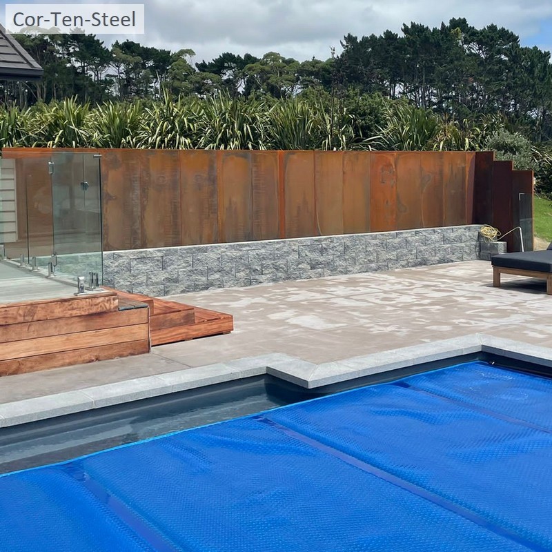 corten fence behind swimming pool